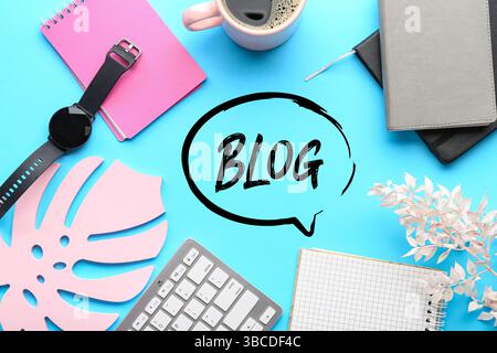 Office supplies and word BLOG on blue background Stock Photo