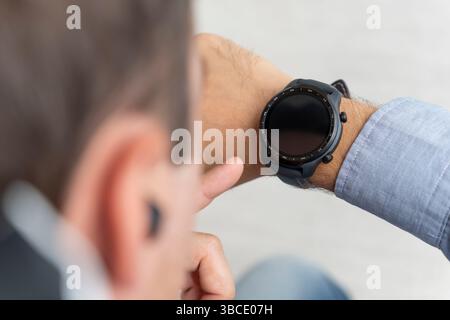 Smartwatch blank screen mock up wear on the hand.. Steel metallic hand time clock mockup metal band. Smartwatch design presentation empty display temp Stock Photo