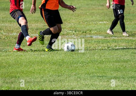 training of athletes football players on the grass on the football field. Stock Photo