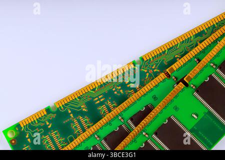 Green circuit board RAM modules memory chips intricate wiring, ideal for electronic design Stock Photo
