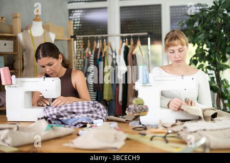 Two female tailors working in the workshop Stock Photo