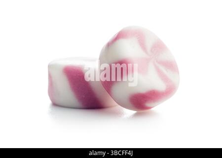 Colorful striped candies isolated on a white background. Stock Photo