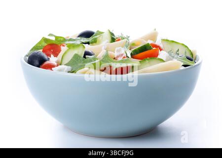Mediterranean Pasta Salad with Fresh Vegetables and Herbs isolated on white background Stock Photo