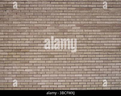 A full frame light brown textured brick wall background Stock Photo