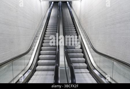 Horizontal view of a long empty escalator in a train station in Zurich in Switzerland Stock Photo