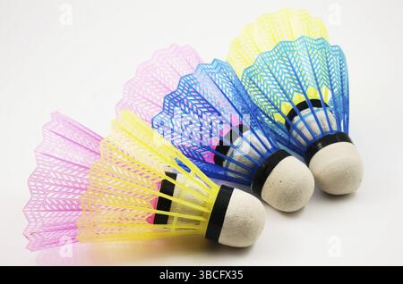 Shuttlecocks in different colors on white background Stock Photo