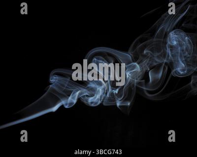 Abstract smoke in blue on a black studio background Stock Photo