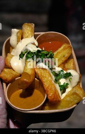 Triple cooked chips and dips street food at a food market Stock Photo