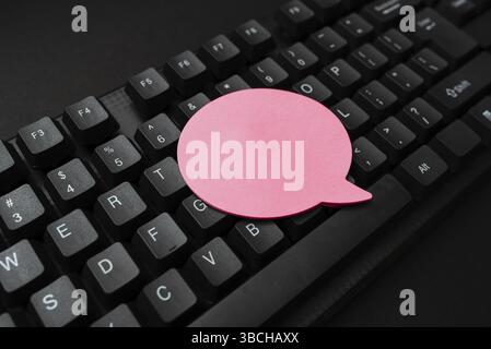 Sticky Note Placed On Keys. Notes On Keyboard, Speech Cloud Shape Note Top View, Business Notes Office Workign In The Busienss Set Up Showing Space Fo Stock Photo