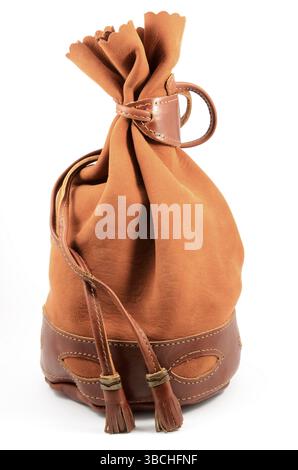 Brown suede pouch on white background, vertical Stock Photo