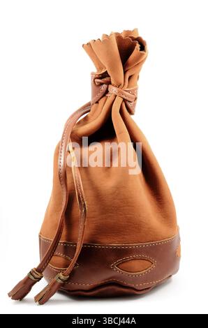 Brown suede pouch on white background, vertical Stock Photo