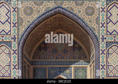 Ornate arches and blue tiling distinguish the Ulugh Beg Observatory in historic Samarkand Uzbekistan, a symbol of scientific progress. Stock Photo