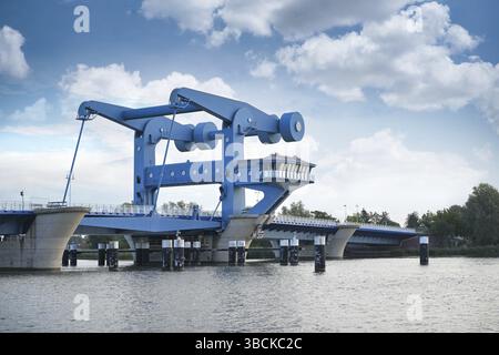 Bascule bridge in Wolgast called Blaues Wunder (blue miracle), combined road and railroad bridge over the Peene river connecting the mainland in in Me Stock Photo