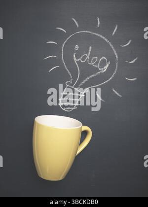 Coffee cup with a light bulb and the word idea on a chalkboard, great idea concept Stock Photo