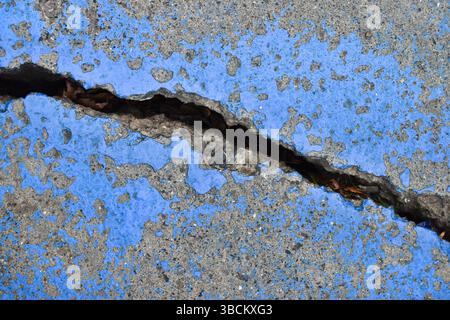 Large cracked concrete surface. Deeply cracked, broken, damaged old wall Stock Photo