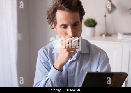 Man working remotely with a positive attitude Stock Photo