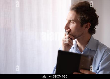 Freelance executive planning a project from home with focus and organization Stock Photo