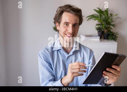 Man working remotely with a positive attitude Stock Photo
