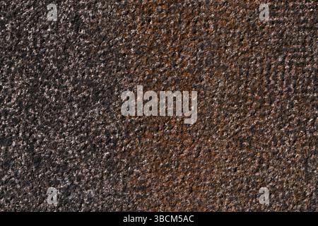Hammered granite background in black and red Stock Photo
