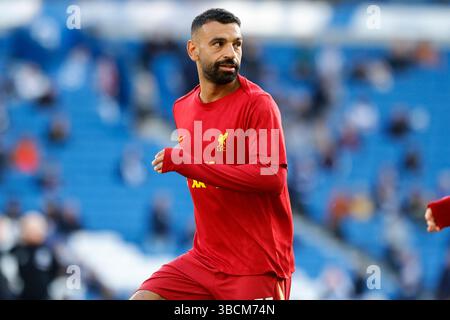 Mohamed Salah warms up for Liverpool FC at the AMEX Stadium in Brighton Stock Photo