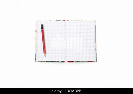 Blank open squared text book with red pencil, isolated on white Stock Photo