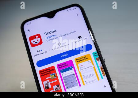 San Francisco, CA, May 20, 2025: Smartphone shows Reddit app on Google Play, highlighting its role in online discussions, news sharing, and communities. Stock Photo