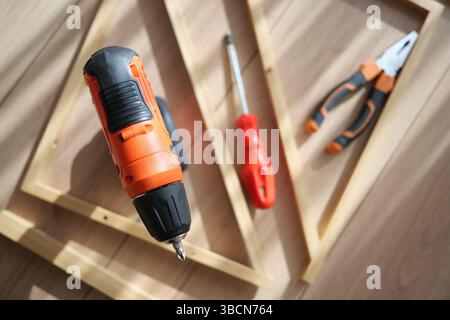 Tools arranged for a woodworking project in natural light Stock Photo