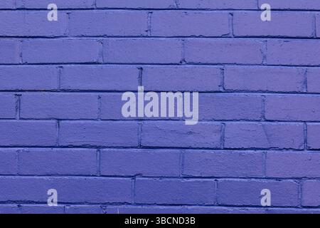 purple painted brick wall Stock Photo