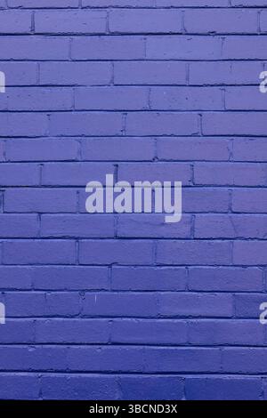 purple painted brick wall Stock Photo