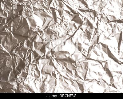 Texture of crumpled aluminum foil using as background or header Stock Photo