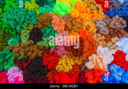 Yarn. Background from multi-colored threads for knitting closeup. Stock Photo
