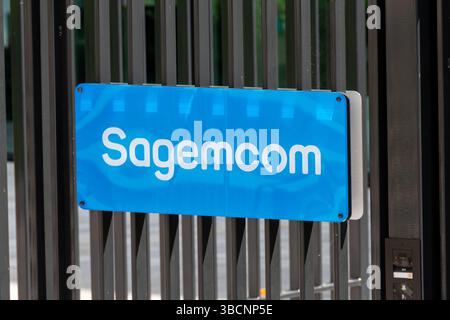 Sign at the entrance to the headquarters of Sagemcom, formerly Sagem Communications, a French company specializing in communicating terminals Stock Photo