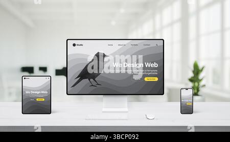 Bright white office with desktop, tablet, and phone showing responsive web design, featuring polygon bird graphic and 'We design web' headline Stock Photo
