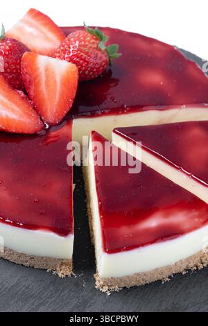 CheesecakCheesecake with strawberries isolated on white backgrounde with strawberries isolated on white background Stock Photo
