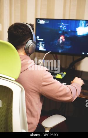 Young man playing a computer game Stock Photo