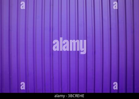 Abstract background featuring vertical stripes in shades of purple, ideal for modern design, branding, or digital art projects. Stock Photo