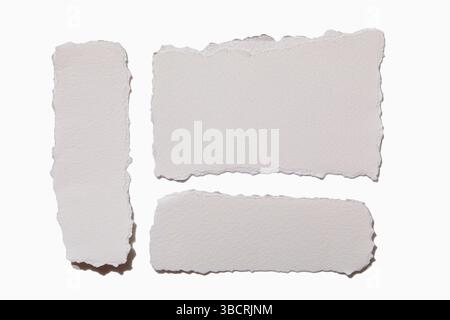 Torn white paper on white background Stock Photo