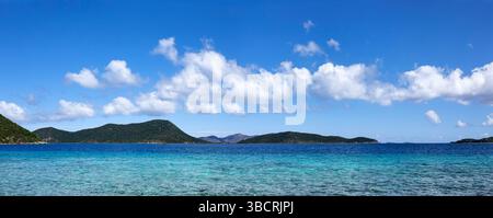Blue sky with puffy clouds over Caribbean sea Stock Photo