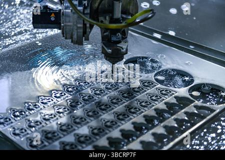Industrial CNC water jet cutting machine cutting steel plate,cutting machine modern industrial technology. Stock Photo