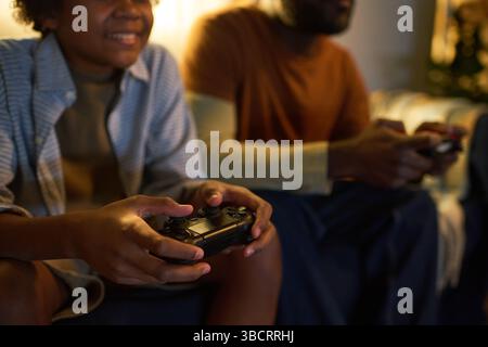 Playing Video Games Together on Couch Stock Photo