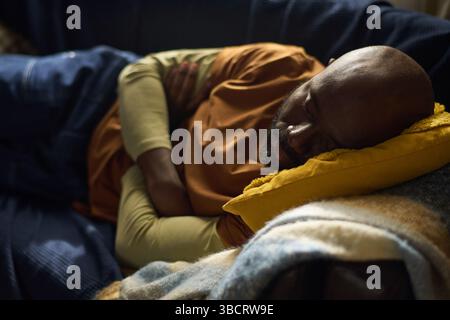 Resting Man Sleeping Peacefully on Couch Stock Photo