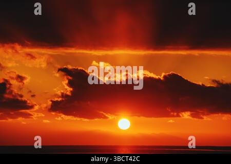Fiery red sunset over lake Stock Photo