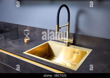 Flat cooktop cooking induction electric built black stove. Grey countertop with black glossy built in ceramic tempered glass induction or electric hob Stock Photo