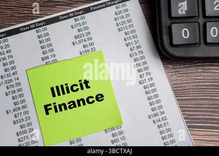 Concept of Illicit Finance write on sticky notes isolated on Wooden Table. Stock Photo