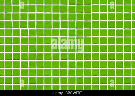 Green square ceramic tiles. Mosaic wall pattern background. Seamless bathroom design. Geometric repetition. Clean bright texture. Fresh vivid green. Stock Photo