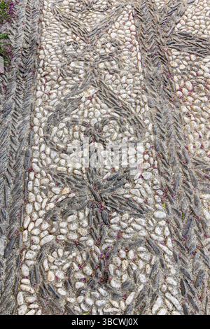 Albaicin, Province of Granada, Andalusia, Spain. Decorative pattern on a sidewalk paved with black and white stones. Stock Photo