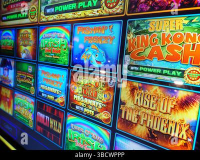 Screen showing variety of popular slot machine gambling games, UK Stock Photo