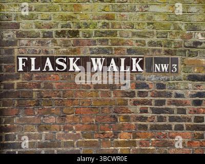 Flask Walk, NW3 street name sign on an old brick wall in Hampstead, London, UK Stock Photo