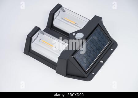 Double solar wall lamp, outdoor, waterproof, motion sensor, powerful lighting Stock Photo