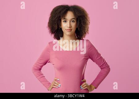 Serious facial expression, beautiful curly haired model Stock Photo